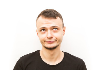 Obraz premium emotion smirk, young man in a black cap on a white background, man emoji