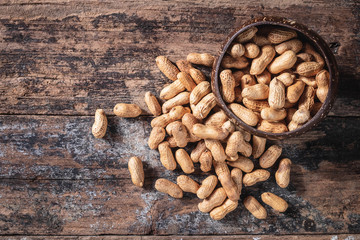 Peanuts on a wooden background