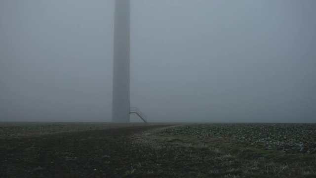 Legnica, Poland - The post of a windmill standing straight buried in the ground - wide shot 