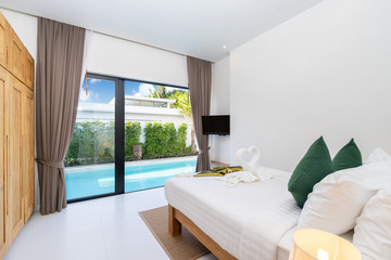 spacious bedroom pool access in luxury home