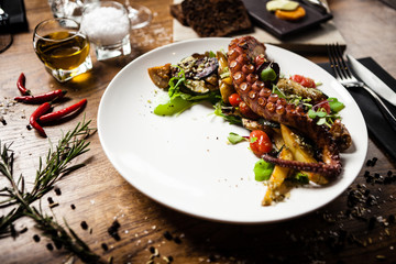Octopus salad served on a plate in restaurant