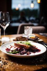 Duck breast served on a plate in restaurant