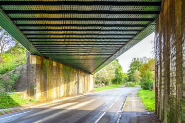 railway bridge with road underneath in england uk