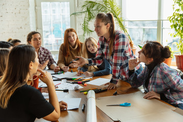 Teamwork. Young people discussing about women rights and equality at the office. Caucasian businesswomen or office workers have meeting about problem in workplace, male pressure and harassment.