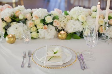 Beautiful table setting with white flowers