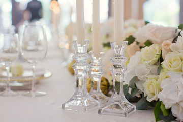 Beautiful table setting with flowers and candles