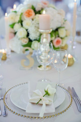 Beautiful table setting with white flowers
