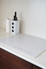 White induction cooktop in the kitchen