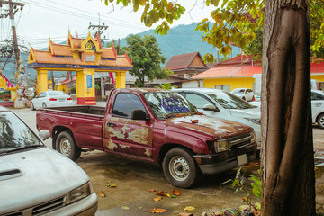 Old broken and rusty Car in summer Asia