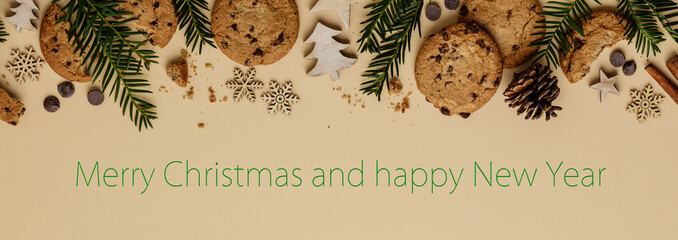 Christmas background with Chocolate chip cookies and wooden decorations