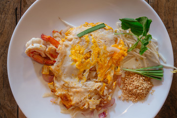 Local food called Pad Thai Noodles with Shrimps. Street food in Bangkok, Thailand.