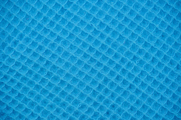 Blue natural texture of knitted wool textile material background.  cotton fabric woven canvas texture