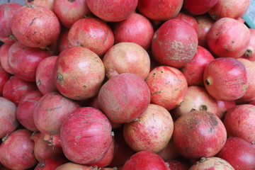 closeup of pomegranates on display at the market