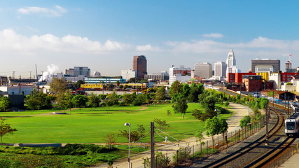 Beautiful view of downtown LOS ANGELES with Skyscrapers, City Hall and Railroad with Train moving...