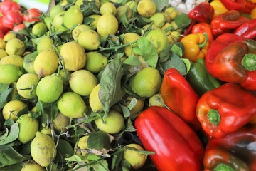 closeup of lemons and peppers exposed to the market