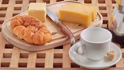 cup of coffee and cake on wooden table