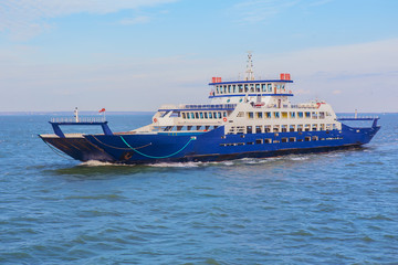 Sea freight ferry moves along the sea