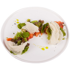 Tartar with tuna fillet, fish sauce, pickled calrabi, mozzarella cream and salad isolated on white.