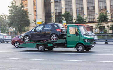 Tow truck transports a car