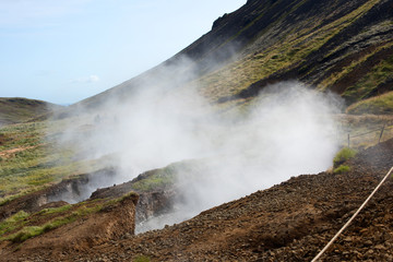 Hot Spring Hiking and Natural Bathing in Geothermal Hot River Reykjadulur, Iceland, Europe.