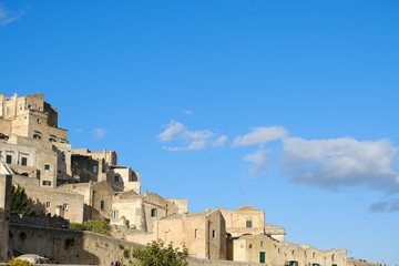 Fototapeta na wymiar Houses in tuff stone from the city of Matera. Many homes are transformed into hotels and B & Bs.