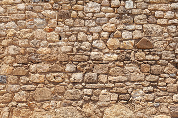 very old stone wall of stones, background