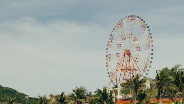 Design Layout or template for video editing. A huge ferris wheel on a background of blue sky.