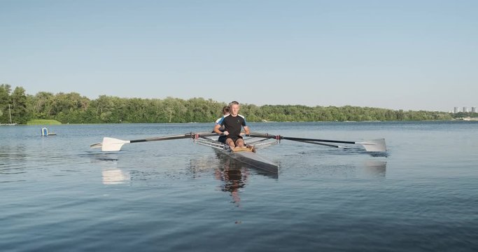 Active healthy lifestyle teens. Boys 15, 16 years old paddling sport kayak on water