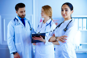 Attractive female arab doctor in front of medical stuff