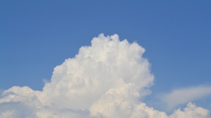 Clouds captured in daytime, with blue sky background.