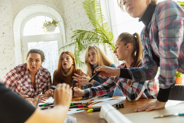 Teamwork. Young people discussing about women rights and equality at the office. Caucasian businesswomen or office workers have meeting about problem in workplace, male pressure and harassment.