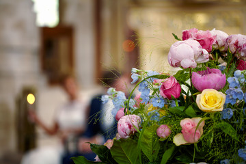 Wedding flowers, bridal bouquet closeup. Decoration made of roses, peonies and decorative plants, close-up, selective focus, nobody, objects
