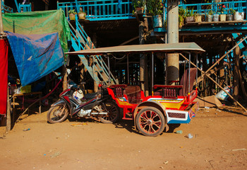 Fototapeta premium Tuk-Tuk Taxi, Old broken and rusty Car in summer Asia
