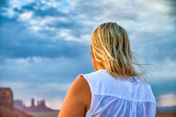 Back view of woman enjoying the view of Monument Valley National park