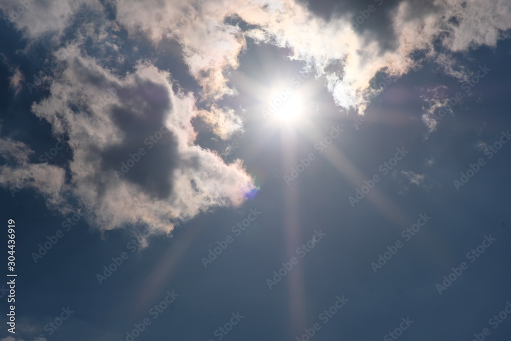 Wall mural blue sky with clouds and sun