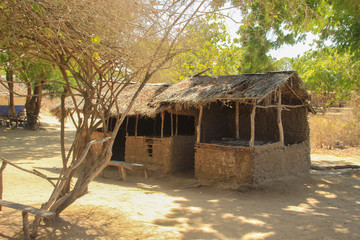 A poor village hut made of wood and clay. The traditional African home of the poor in the village.