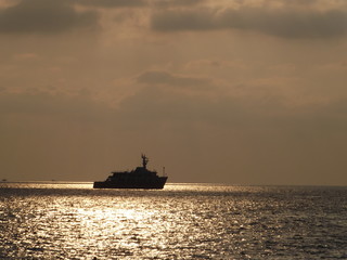 ship in the sea at sunset