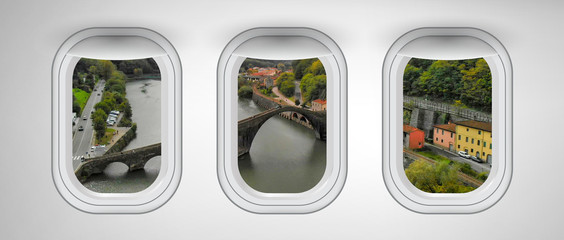 Beautiful scenic view of Devil's Tower Bridge in Lucca through the aircraft windows