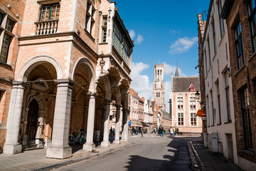 Ancient street of the old city of Brugge in Belgium. An empty street extending into the distance in sunny weather.