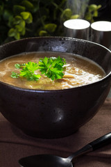 Hot mushroom soup with noodles. Small depth of field.