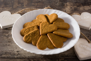Heart shaped cookie on wooden table. Valentine's Day and Mother's Day concept.	