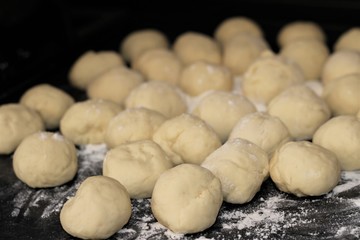 balls of raw dough, preparation for baking