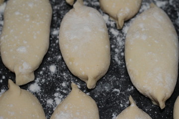 raw pies in flour for frying