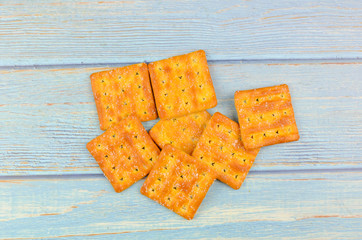 Sugar crackers on wooden background.