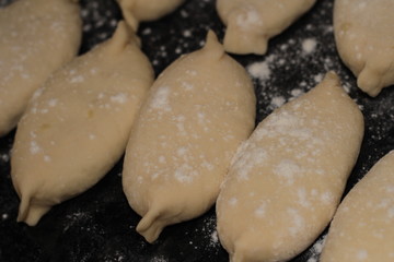 raw pies in flour for frying