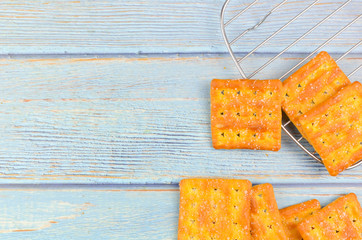 Sugar crackers on wooden background.