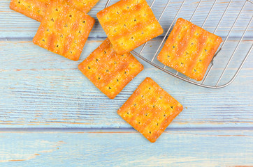Sugar crackers on wooden background.
