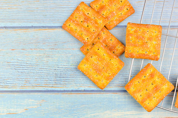 Sugar crackers on wooden background.