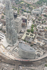 Fototapeta na wymiar LONDON, UK - JUNE 2015: The Shard and other modern buidlings as seen from helicopter, downward view
