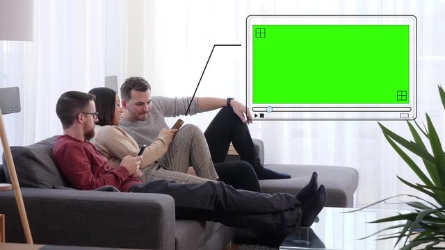 Young woman on couch shows video on her smartphone to male friends - digital green screen insertion with tracking points